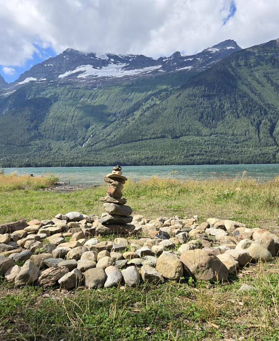 Stone cairn beside a glacial lake